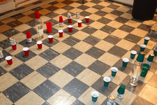 beer pong chess board on a kitchen floor